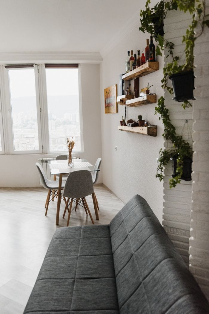 Crafting Captivating Headlines: Your awesome post title goes here Cozy modern apartment featuring a minimalist Scandinavian design with plants and rustic elements.